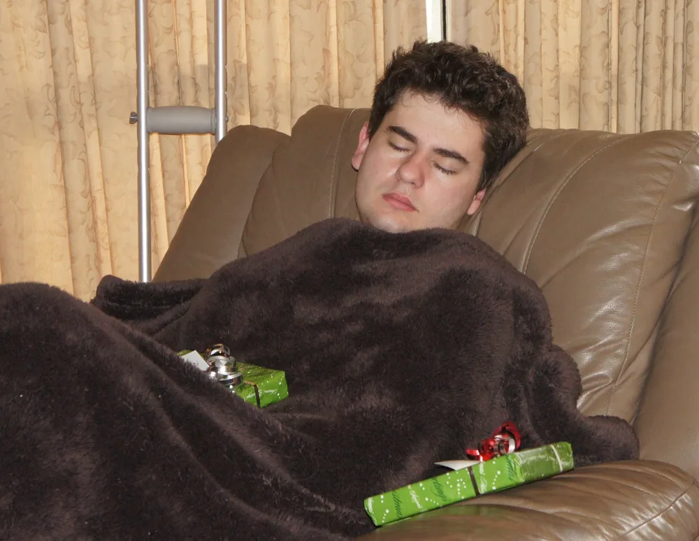 Todd resting in a lounge chair on Christmas Day during his recovery